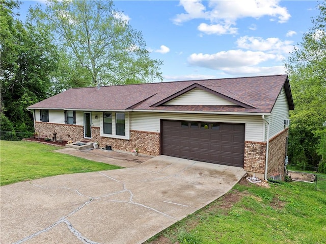 single story home with concrete driveway, brick siding, an attached garage, and a front yard