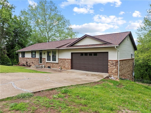 single story home with an attached garage, concrete driveway, a front lawn, and brick siding