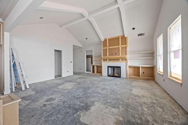 unfurnished living room featuring high vaulted ceiling, beamed ceiling, a fireplace, and visible vents