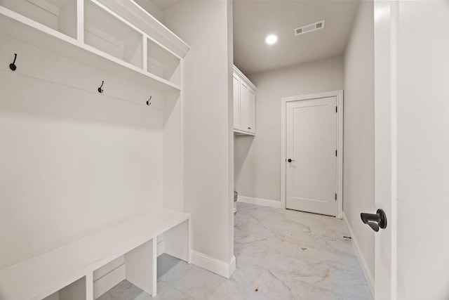 mudroom featuring recessed lighting, marble finish floor, visible vents, and baseboards