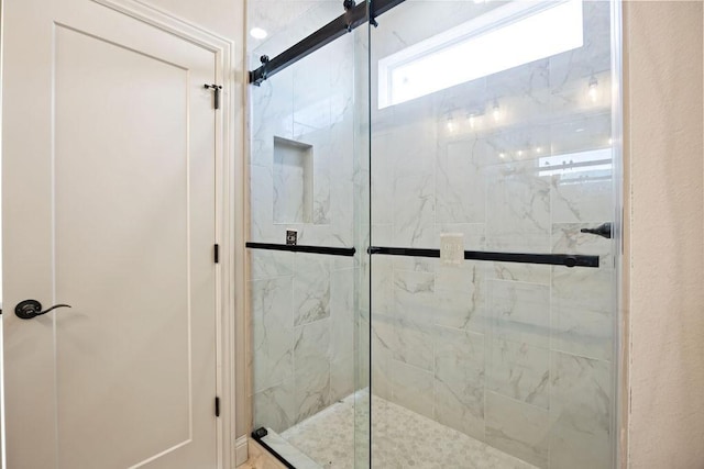 bathroom featuring a shower stall
