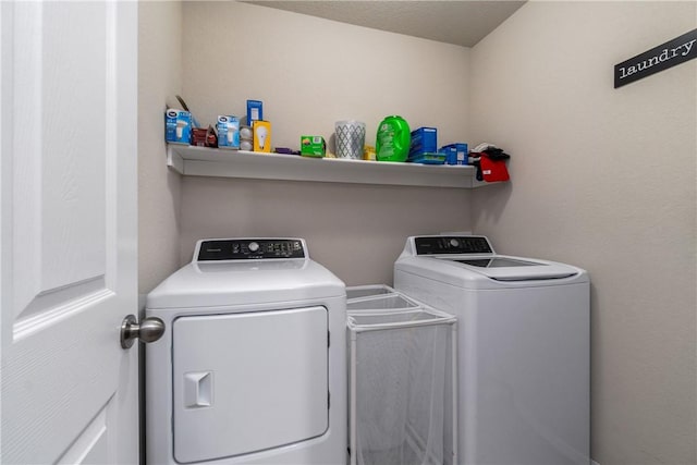 laundry area with laundry area and separate washer and dryer