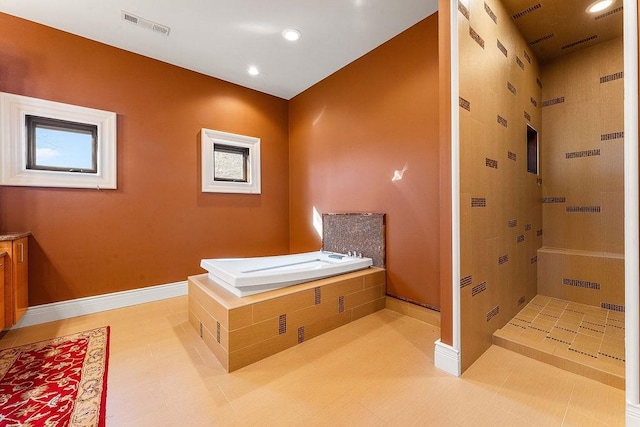 full bathroom with a stall shower, visible vents, baseboards, tile patterned flooring, and a bath