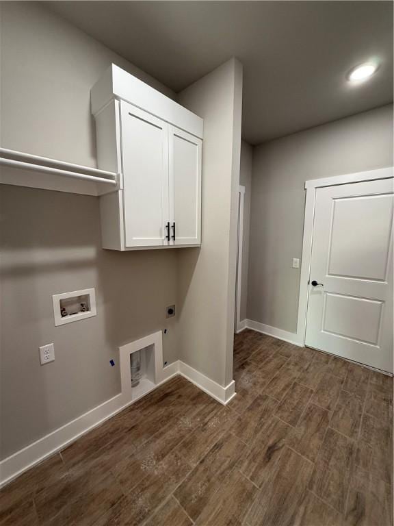 laundry room featuring dark wood-style floors, gas dryer hookup, and hookup for an electric dryer