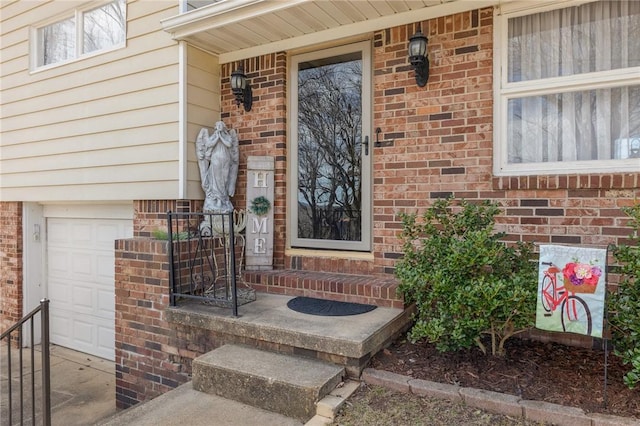 property entrance featuring brick siding