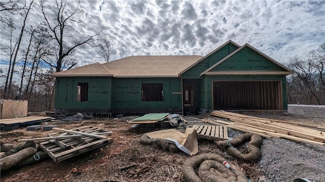 property in mid-construction with an attached garage