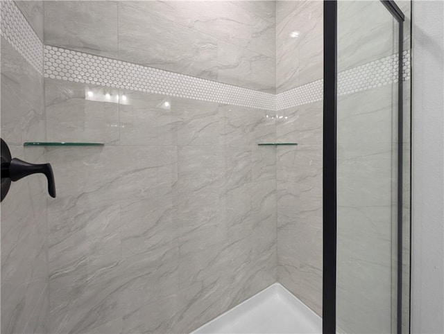 full bath featuring a shower stall