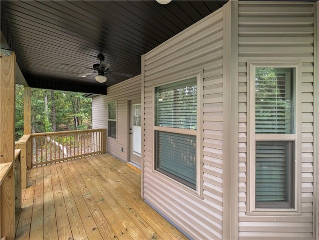 wooden deck featuring ceiling fan