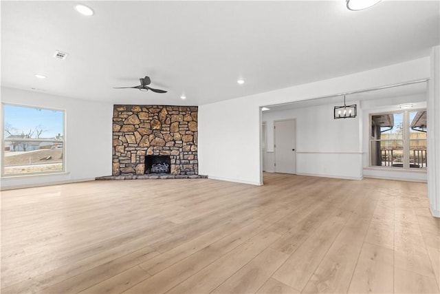 916 S 25th Pl, Rogers, AR 72758 - unfurnished living room with ceiling fan, healthy amount of natural light, light wood-type flooring, recessed lighting, and a fireplace