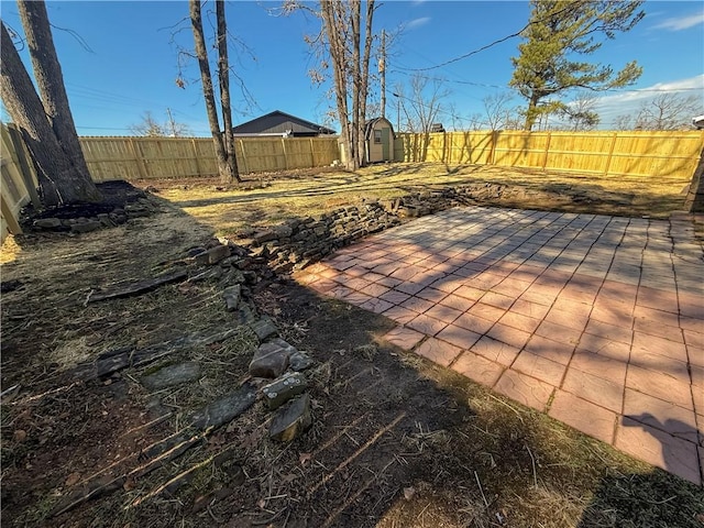 916 S 25th Pl, Rogers, AR 72758 - wooden deck with a storage shed, a fenced backyard, and a patio