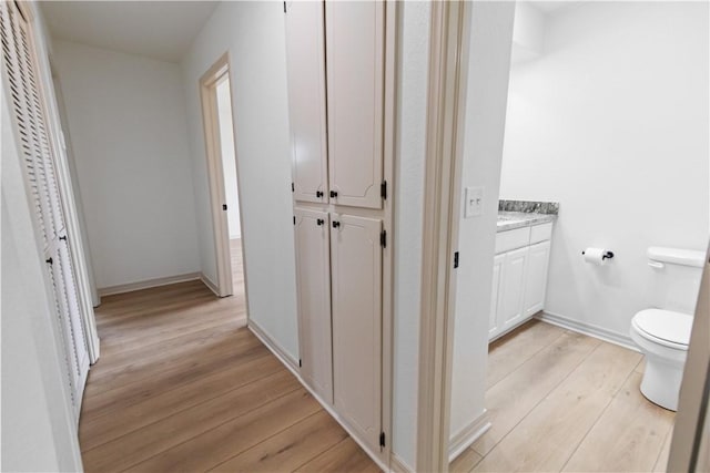916 S 25th Pl, Rogers, AR 72758 - corridor with light wood finished floors and baseboards