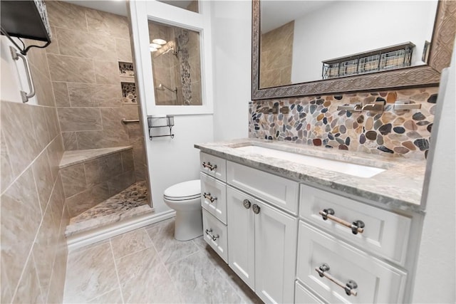 916 S 25th Pl, Rogers, AR 72758 - bathroom featuring vanity, a walk in shower, and decorative backsplash