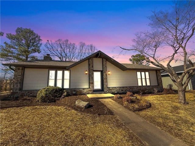 916 S 25th Pl, Rogers, AR 72758 - mid-century home with stone siding and a chimney