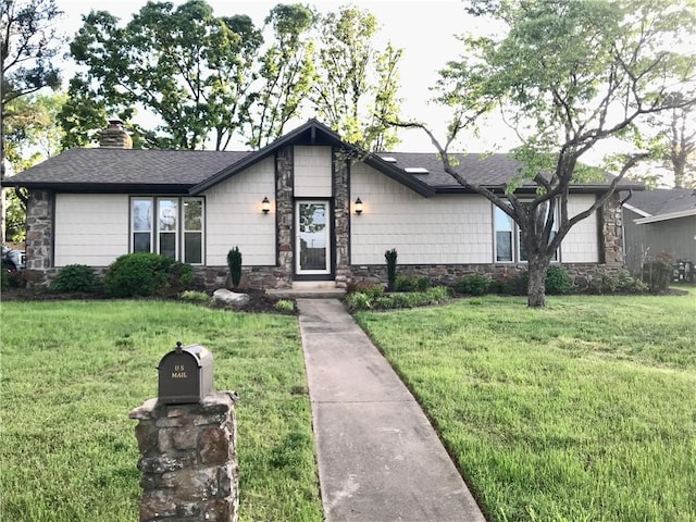916 S 25th Pl, Rogers, AR 72758 - view of front facade featuring stone siding, a front lawn, a chimney, and roof with shingles