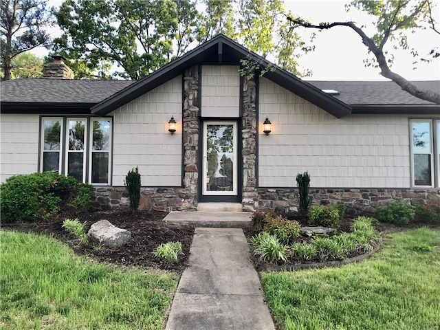 916 S 25th Pl, Rogers, AR 72758 - mid-century modern home featuring stone siding, roof with shingles, and a chimney