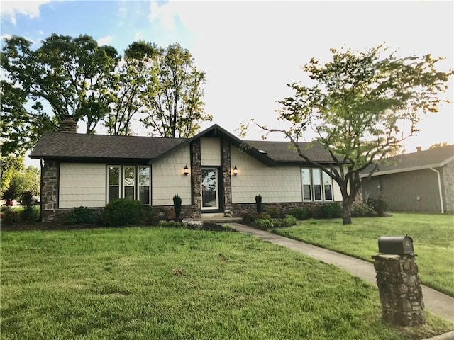 916 S 25th Pl, Rogers, AR 72758 - mid-century home featuring stone siding, a front yard, and a chimney