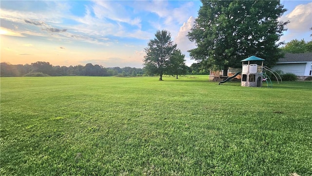 yard at dusk with a playground