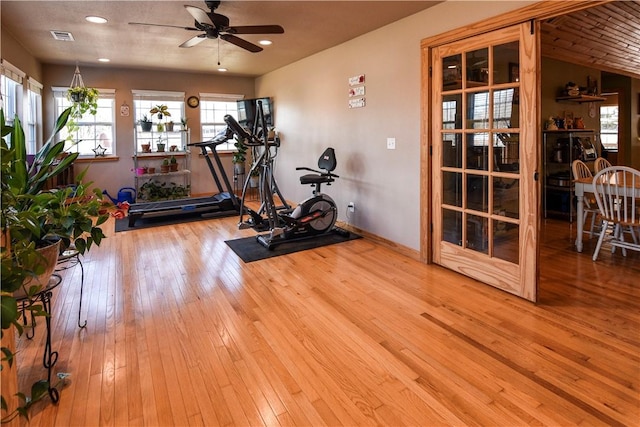 workout area with recessed lighting, visible vents, a ceiling fan, baseboards, and hardwood / wood-style flooring