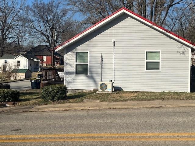 view of side of property featuring ac unit