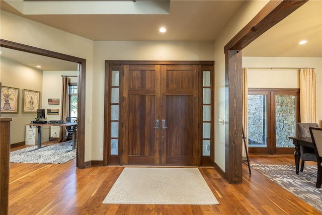 foyer entrance featuring recessed lighting, baseboards, and wood finished floors