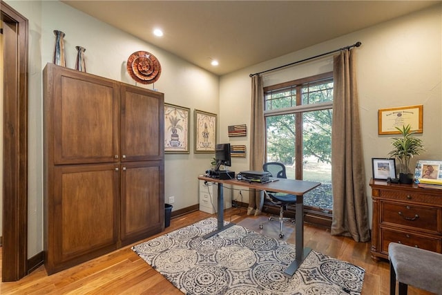 office area with light wood finished floors, baseboards, and recessed lighting