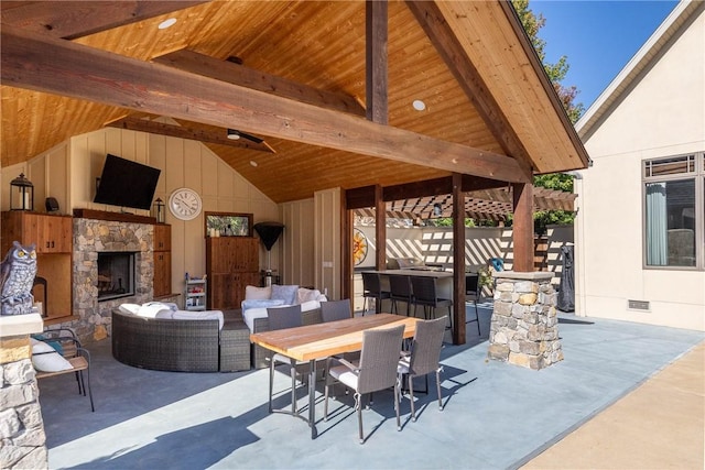 view of patio / terrace featuring an outdoor living space with a fireplace