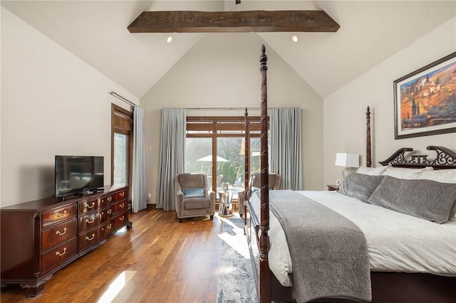 bedroom with high vaulted ceiling, light wood finished floors, beamed ceiling, and access to exterior