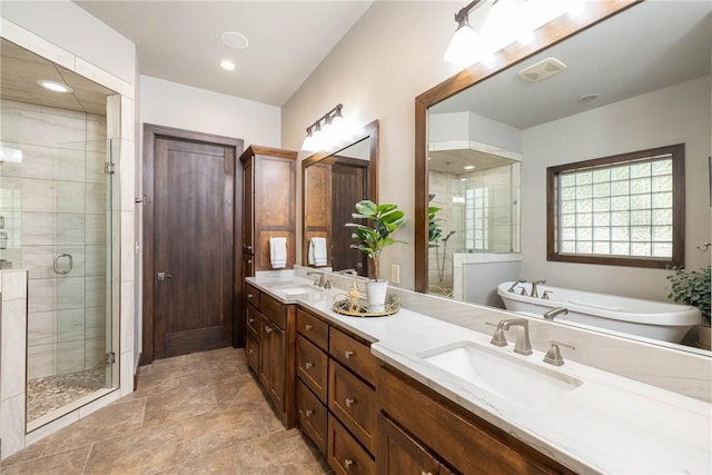 bathroom featuring double vanity, recessed lighting, a sink, and a shower stall