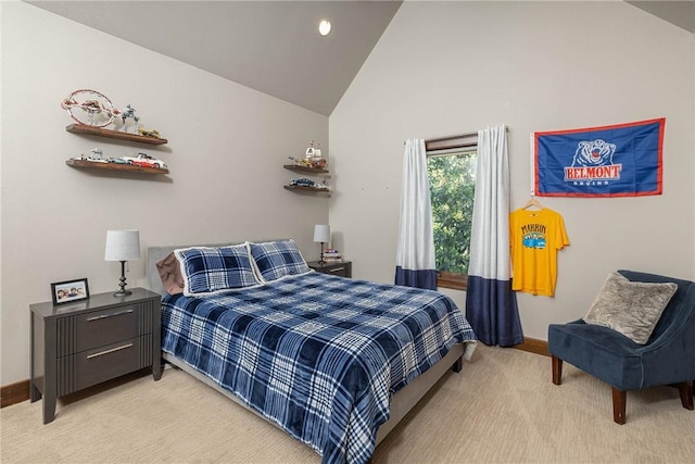 bedroom with light carpet, baseboards, and lofted ceiling