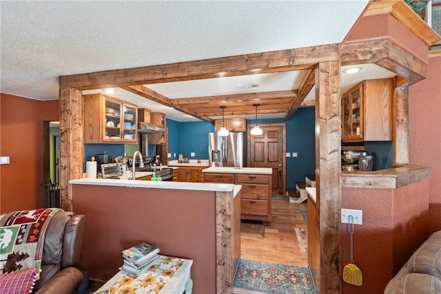 19407/19403 Dawn Hill E Rd, Gentry, AR 72734 - kitchen with brown cabinets, appliances with stainless steel finishes, a peninsula, light wood-type flooring, and glass insert cabinets