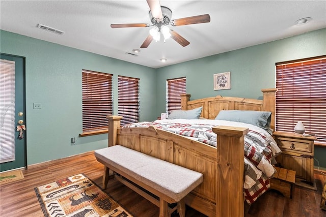 19407/19403 Dawn Hill E Rd, Gentry, AR 72734 - bedroom featuring visible vents, ceiling fan, and wood finished floors