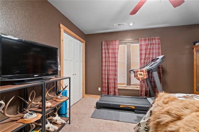 19407/19403 Dawn Hill E Rd, Gentry, AR 72734 - exercise area featuring baseboards, carpet, a ceiling fan, and visible vents