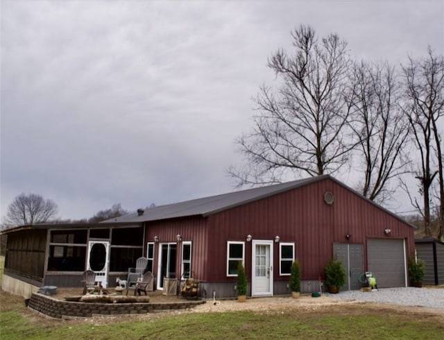 view of front facade with an outdoor structure and an outdoor fire pit