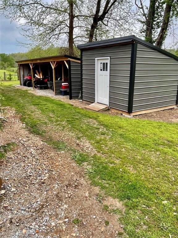 19407/19403 Dawn Hill E Rd, Gentry, AR 72734 - view of pole building featuring a lawn and a carport