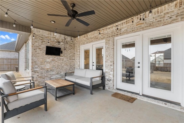 view of patio / terrace with ceiling fan, french doors, outdoor lounge area, and fence