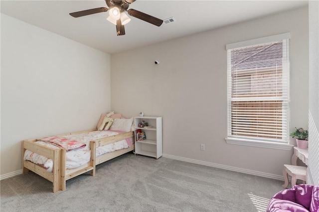 bedroom with ceiling fan, carpet flooring, visible vents, and baseboards