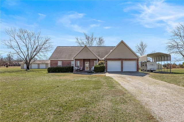 view of front of home with brick siding, a detached carport, an attached garage, driveway, and a front lawn