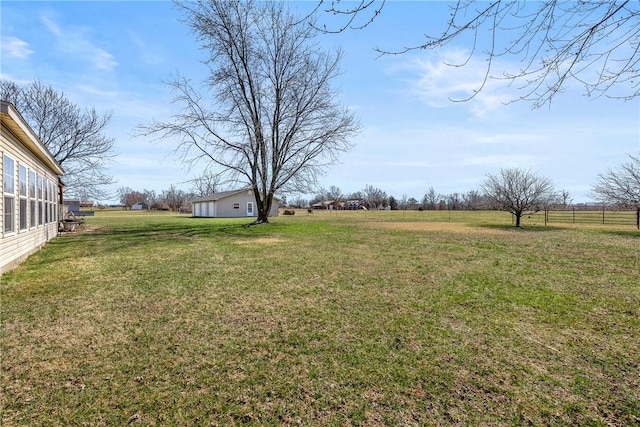 view of yard with a rural view