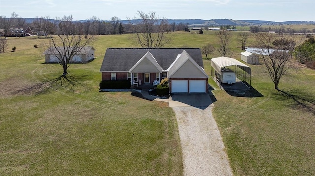 birds eye view of property featuring a rural view