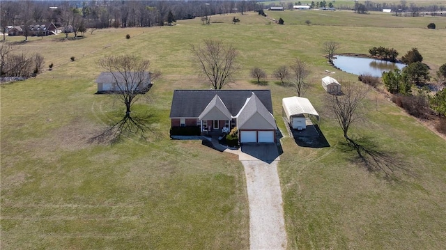 drone / aerial view with a rural view and a water view