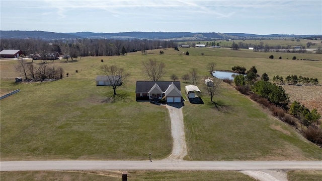 birds eye view of property with a mountain view and a rural view