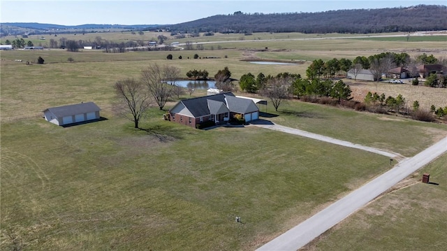 birds eye view of property featuring a rural view and a water and mountain view