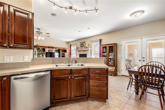 kitchen with dishwasher, french doors, a sink, and a wealth of natural light