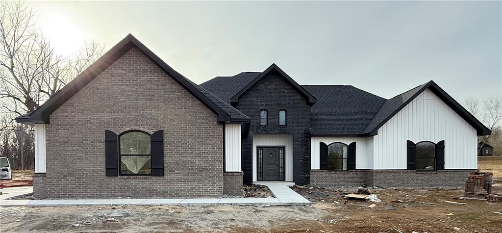 view of front of house featuring brick siding