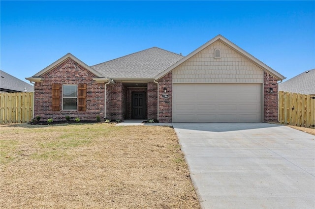 single story home with a garage, driveway, fence, and a front lawn