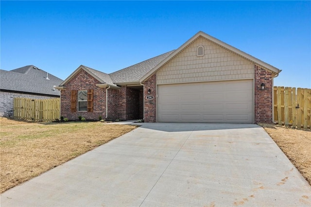 ranch-style house featuring driveway, a garage, fence, and brick siding