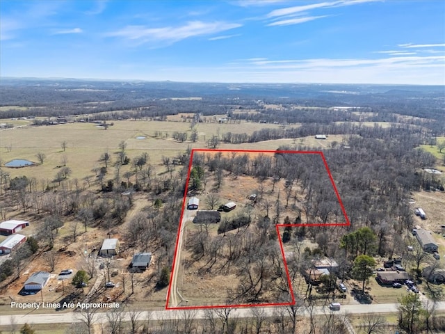 birds eye view of property with a rural view