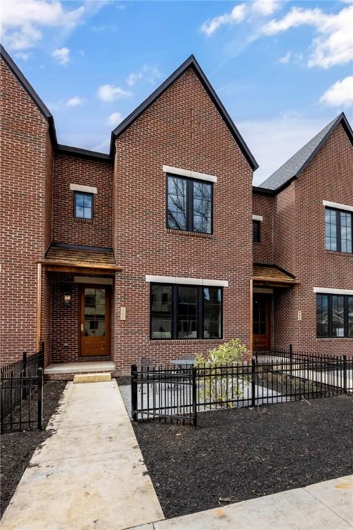 445 NW C St, Bentonville, AR 72712 - view of front of house featuring brick siding
