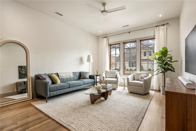 445 NW C St, Bentonville, AR 72712 - living room with wood finished floors and a ceiling fan