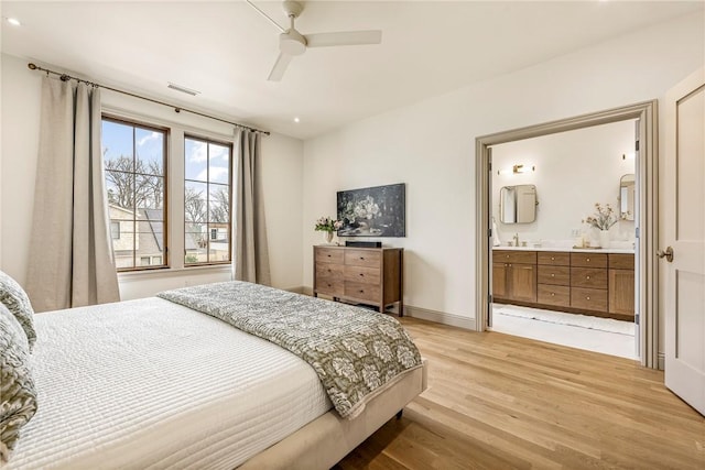 445 NW C St, Bentonville, AR 72712 - bedroom featuring light wood finished floors, recessed lighting, connected bathroom, and a ceiling fan